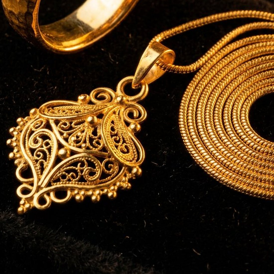 22K Gold Pendant Set with Chain, 22K yellow gold jewellery photographed on a dark luxury background — Chauhaan Jewellers, Edison NJ